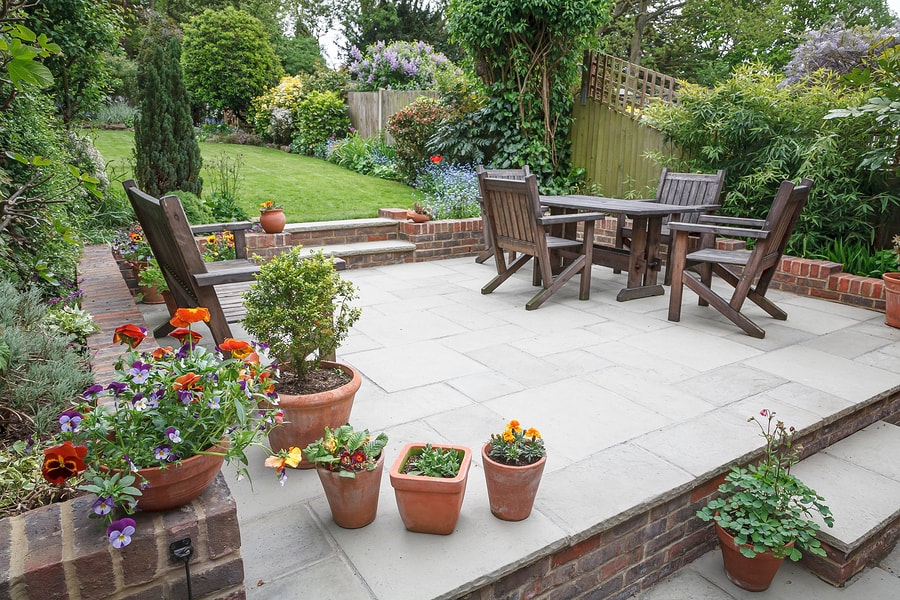 Elaborate garden patio with newly added concrete reinforced patio slabs.