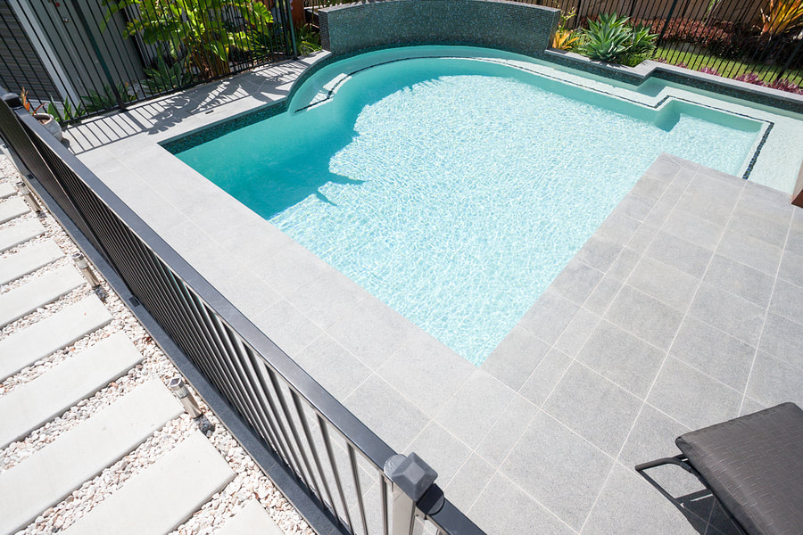 pool with stamped concrete. Notice the elegant design!